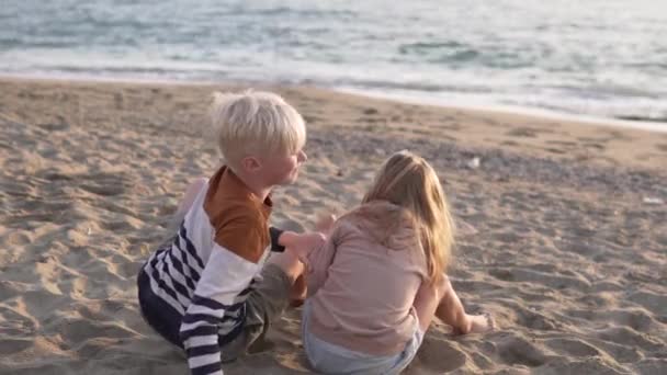 Blond Boy Hugs His Little Sister Beach Sea — Video