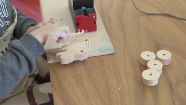 Child Makes Wooden Hare Kindergarten — Video Stock