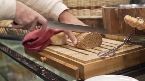 Man Face Cuts Piece Bread Knife Cut Bread — Vídeo de Stock