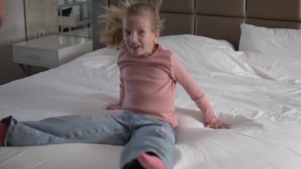 Cheerful Little Girl Falls Bed Hotel — Stock Video