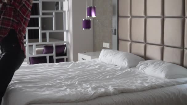 Happy Tourist Jumps Bed Run Slow Motion Shooting Hotel Room — Wideo stockowe