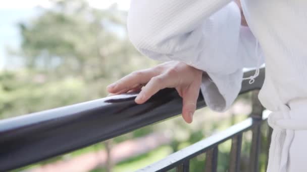 Woman White Coat Stands Balcony Hotel Close Womans Hand Railing — Stok video