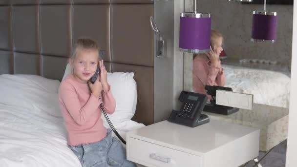 Beautiful Little Girl Talking Landline Phone Hotel Room — Wideo stockowe