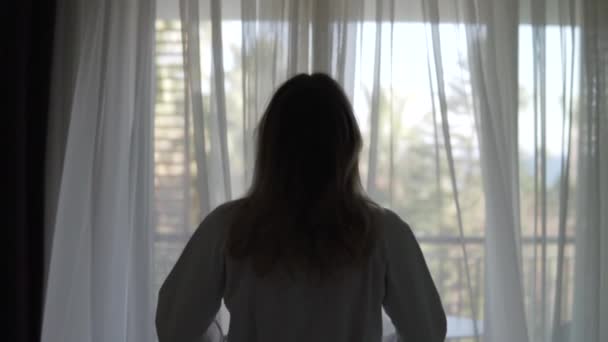 Woman White Coat Opens Curtains Goes Sunny Balcony Hotel Turkey — ストック動画