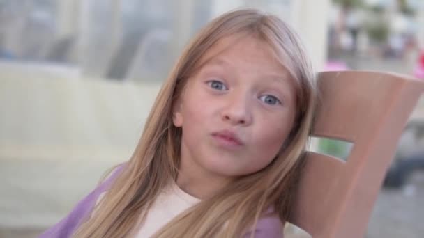 Cute Little Girl Long Blonde Hair Narrows Her Eyes Makes — Stock Video