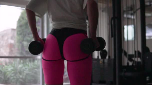 Kind Abrasion Inflated Female Butt Pink Leggings Shakes Her Hands — Stockvideo