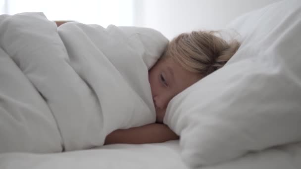 Little Girl Opens Her Eyes Morning Bed — Stock Video