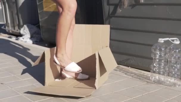 Woman Crumples Cardboard Boxes Garbage Can Street — Stock Video