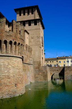 Fontanellato, Parma: the building of the castle La Rocca Sanvitale across the lake on a market day