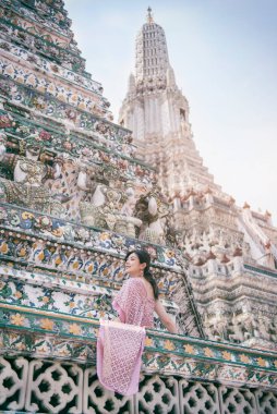 Beautiful Asian girl in Thai traditional costume at temple