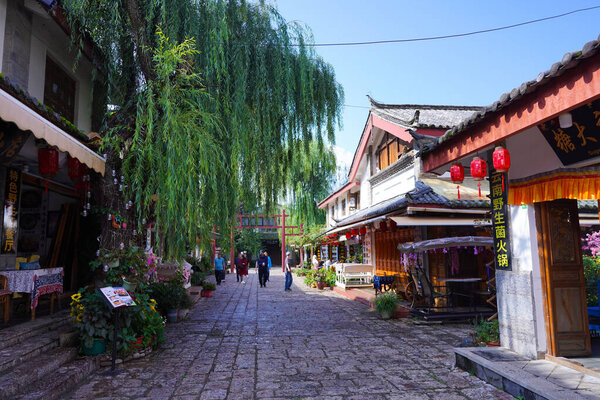 LIJIANG, CHINA - SEP 5, 2023:Scenic old town street and ancient architecture building at Shuhe Village in Lijijang, Yunnan, China.