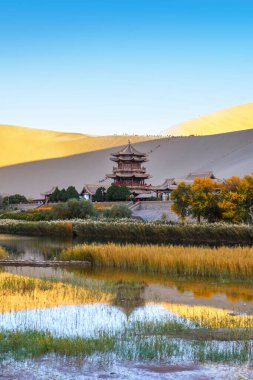 Dunhuang,China-OCT 21 2024- Crescent Lake, called as Yueyaquan, is a crescent shaped lake in the oasis located in Dunhuang city, China clipart