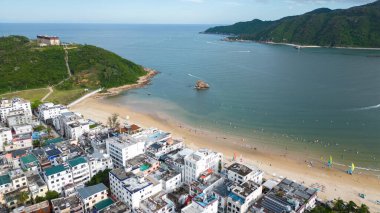 Sanya, China-SEP 14, 2025-The aerial photogrpahy of Houhai Village, also known as Tenghai Fishing Village, is located at the southern end of Haitang Bay, Hainan, China