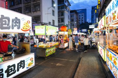 Nanning, China-SEP 10, 2025-The lively night market of Nanning city's downtown. Many street local foods of local people, the big city in Guangxi province, south of China.