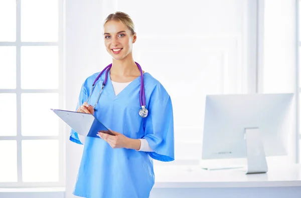 Smiling Female Doctor Folder Uniform Standing — Stock Photo, Image
