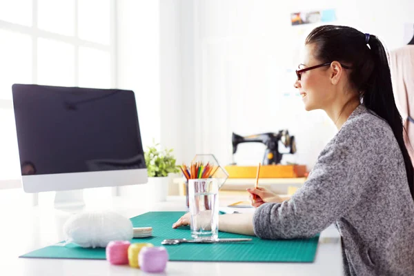 stock image Portrait of Fashion designer working in her studio.