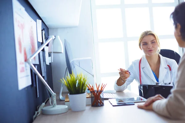 Female Doctor Holding Application Form While Consulting Patient — Stock Photo, Image