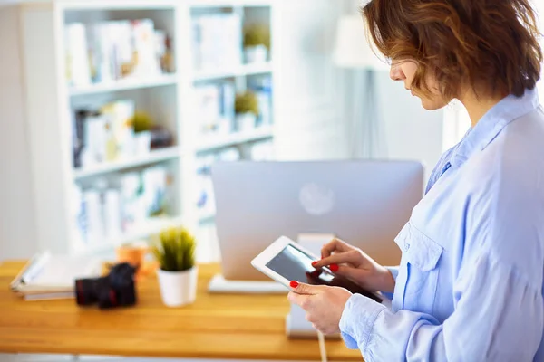 stock image Portrait of an attractive professional photographer woman and using a tablet.