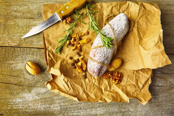 Italian Salami Wih Sea Salt Rosemary Garlic Nuts Paper Rustic — Stock Photo, Image