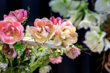 Flower wedding holiday decoration, beautiful pink peony blooming bouquet on black background