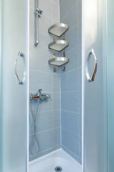 Shower cabin, bathroom interior with gray walls