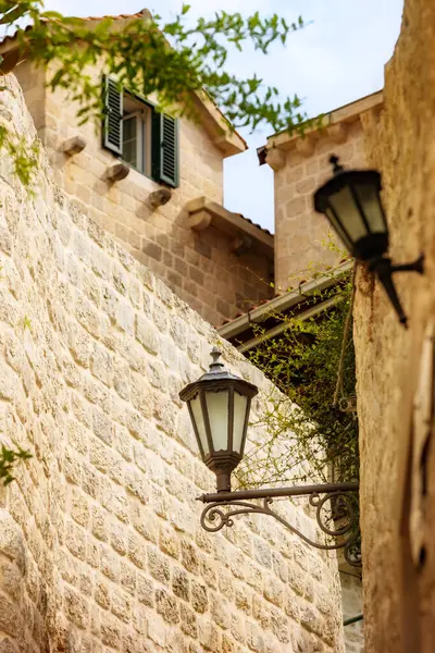 Perast, Montenegro narrow street view in the old town with street lamp, travel tourism background