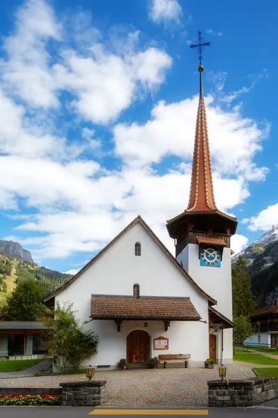 stock image Kandersteg, Switzerland church and bell tower, mountains panorama, Canton Bern, Europe