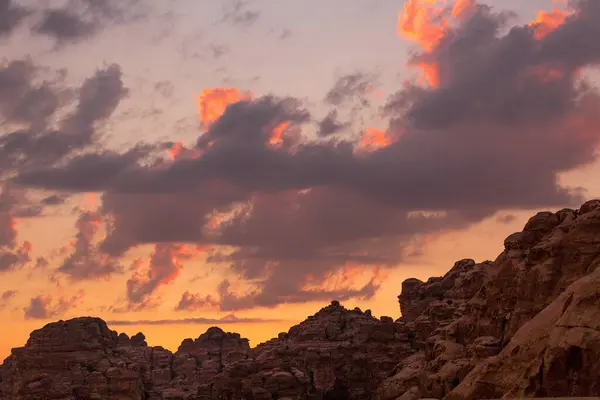 Stock image Sunset colorful orange sky landscape with sandstone rocks in Little Petra archaeological site, Jordan