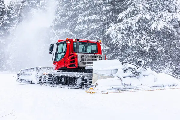 stock image Bansko, Bulgaria ski resort, snow groomer snowcat ratrack machine preparing ski slope for alpine skiing