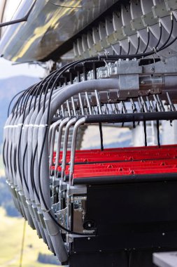 chair lift, many cabins waiting for the season at the station, Dolomites Alpe di Siusi, Italy in summer clipart