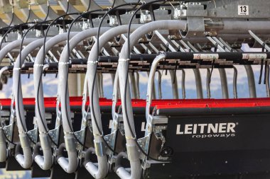 Ortisei, Italy- September 26, 2024: Summer Empty Leitner chairlift of ropeway, many cabins waiting for the season at the station, Dolomites Alpe di Siusi, in summer clipart