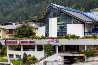 Ortisei, Italy- September 26, 2024: Mont Seuc cable car station station at Val Gardena to Alpe di Siusi, Dolomites mountain range clipart