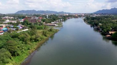 Aerial view of calm Kwai river in Kanchanaburi, Thailand.