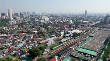 Aerial drone view of Bangkok city downtown. Asian small community with heavy traffic in the Capital of Thailand