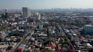 Aerial drone view of Bangkok city downtown. Asian small community with heavy traffic in the Capital of Thailand