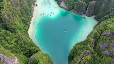 Aerial drone photo of iconic tropical turquoise water Pileh Lagoon surrounded by limestone cliffs, Phi phi islands, Thailand.
