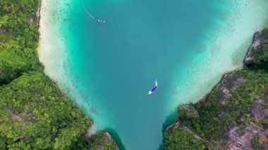 Aerial drone photo of iconic tropical turquoise water Pileh Lagoon surrounded by limestone cliffs, Phi phi islands, Thailand.