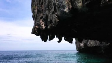 Closeup shot of a limestone rock in the middle of the ocean in Koh Phi Phi.