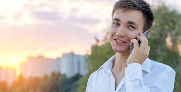 Young Man Talking Phone While Standing City Street Royalty Free Stock Photos