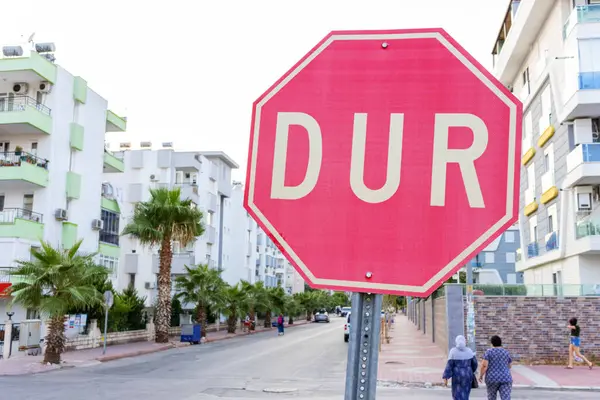 STOP traffic sign on a road in Turkey. Turkish language - DUR sign