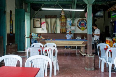 July 10, 2023: Men Playing Pool In Traditional Hall In Pijao, Colombia clipart