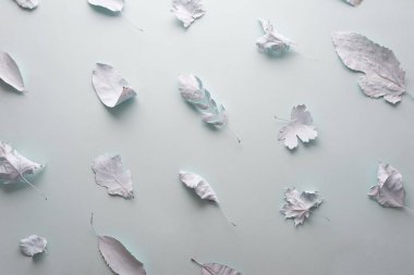 autumn background blue leaves in paint on a blue background minimalism.