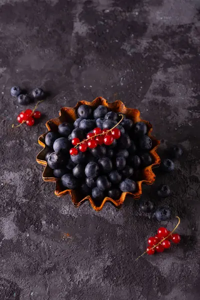minimalistic still life of berries on an abstract background in a rustic style.