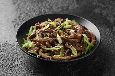 Korean beef Bulgogi BBQ with sesame seeds and spring onion