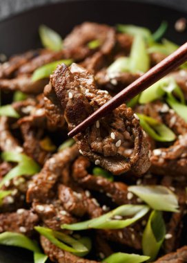 Korean beef Bulgogi BBQ with sesame seeds and spring onion