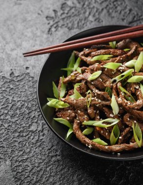 Korean beef Bulgogi BBQ with sesame seeds and spring onion