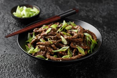 Korean beef Bulgogi BBQ with sesame seeds and spring onion