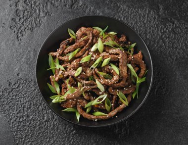 Korean beef Bulgogi BBQ with sesame seeds and spring onion