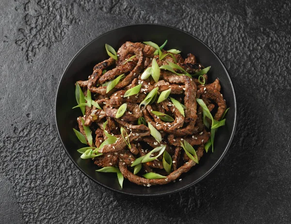 Korean beef Bulgogi BBQ with sesame seeds and spring onion