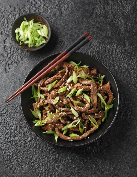Korean beef Bulgogi BBQ with sesame seeds and spring onion